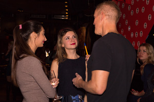 A photo of a a couple at a social with an interpreter