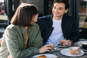 A photo of a man and woman having breakfast